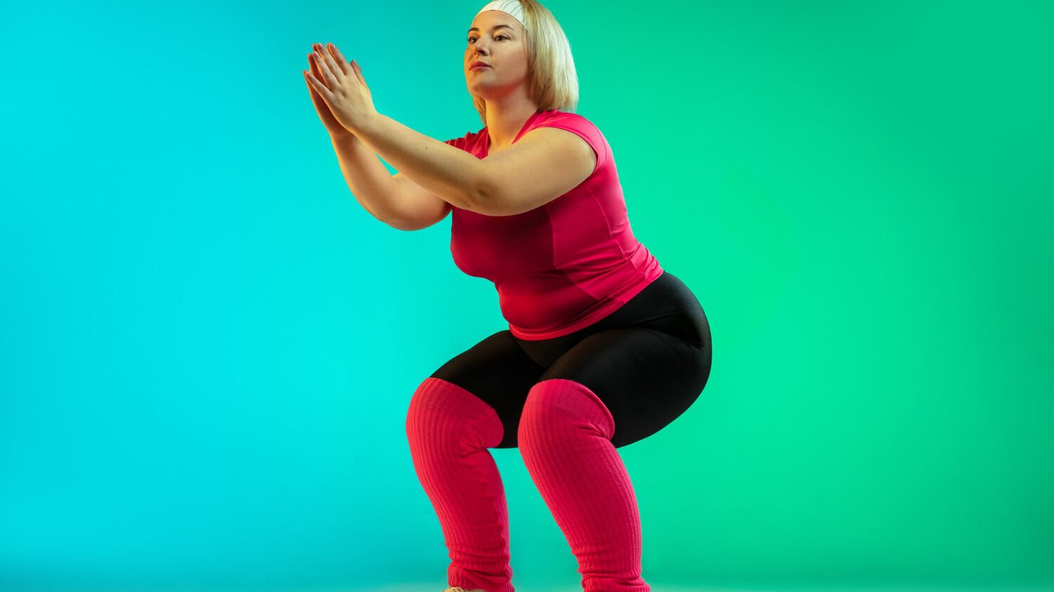 Young Caucasian Plus Size Female Model S Training Gradient Green Background Neon Light Doing Workout Exercises Stretching Cardio Concept Sport Healthy Lifestyle Body Positive Equality