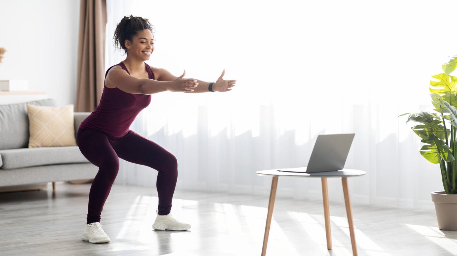 Attractive Black Woman Training Home Having Online Fitness Class