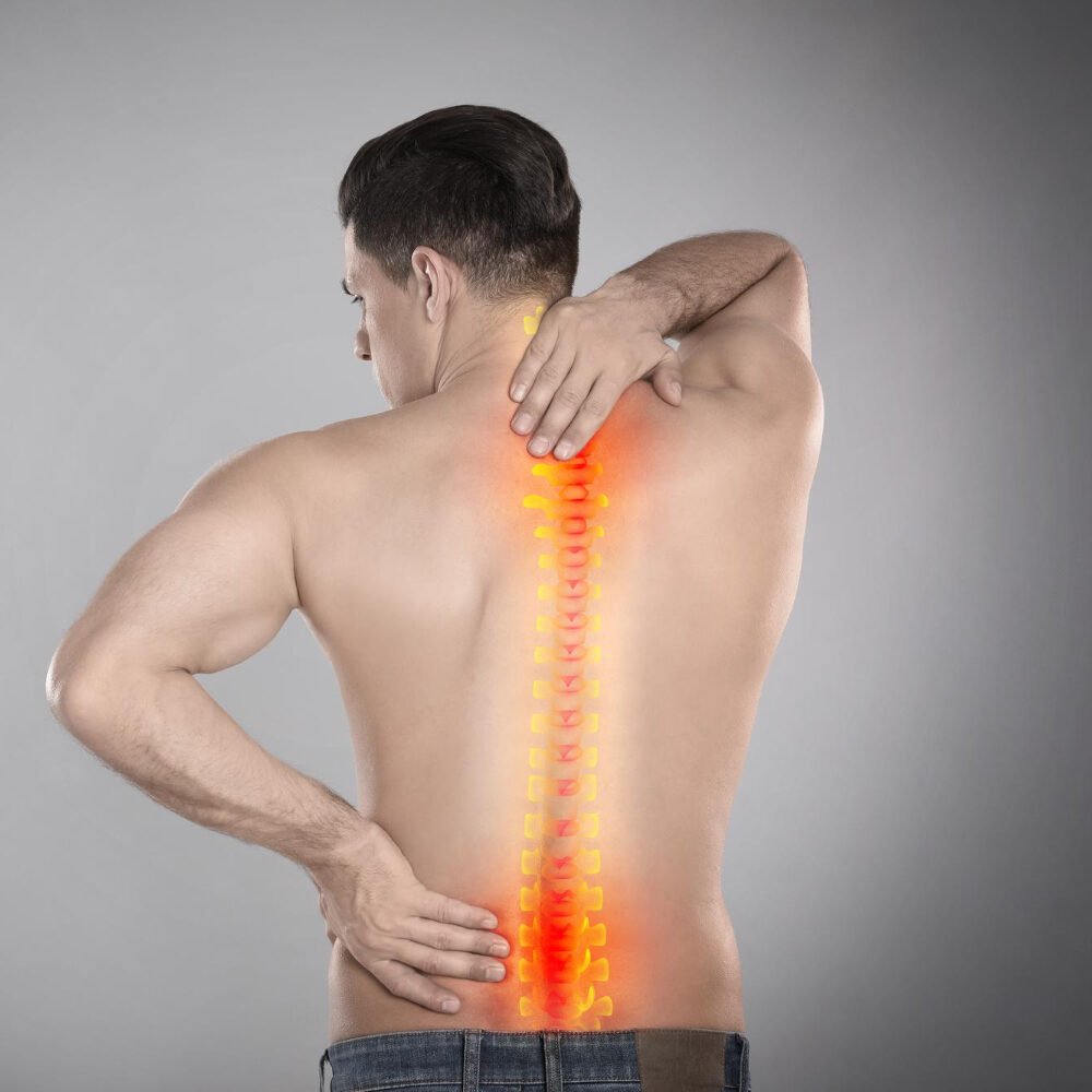 Man Suffering From Pain Spine Grey Background