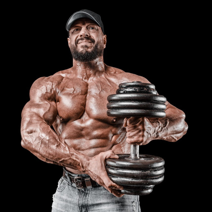Muscular Athlete Posing With Dumbbells Fitness Classic Bodybuilding Concept