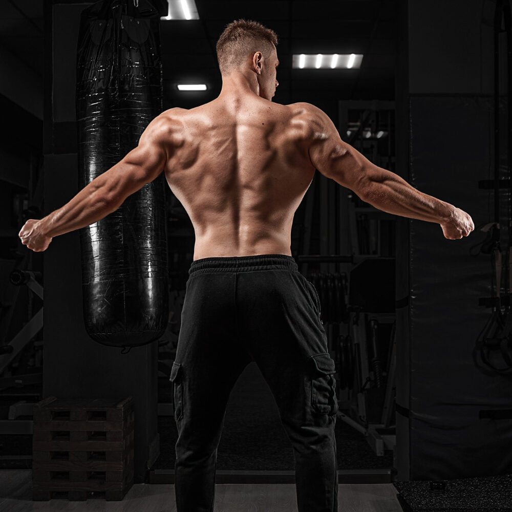 Strong Athletic Man Fitness Model Posing Back Muscles Triceps Latissimus Dark Background 1