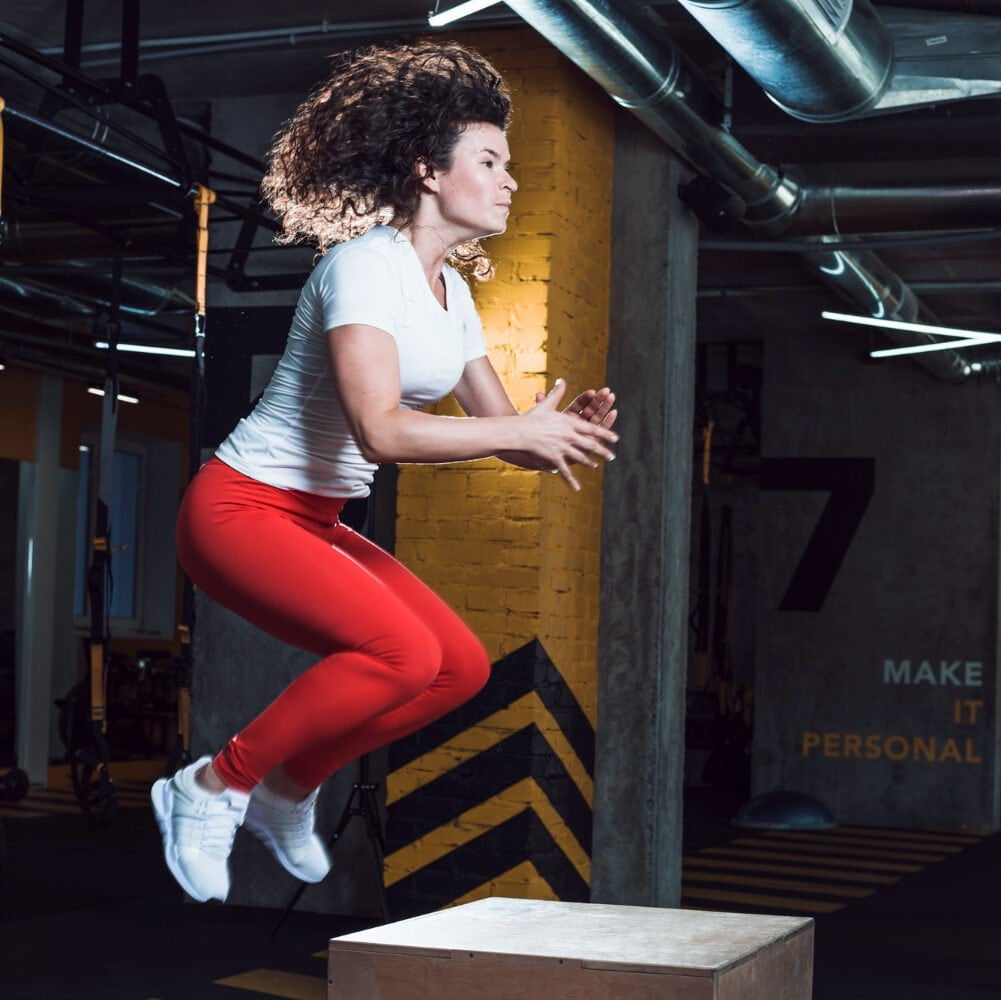 Woman Jumping Wooden Box Fitness Club